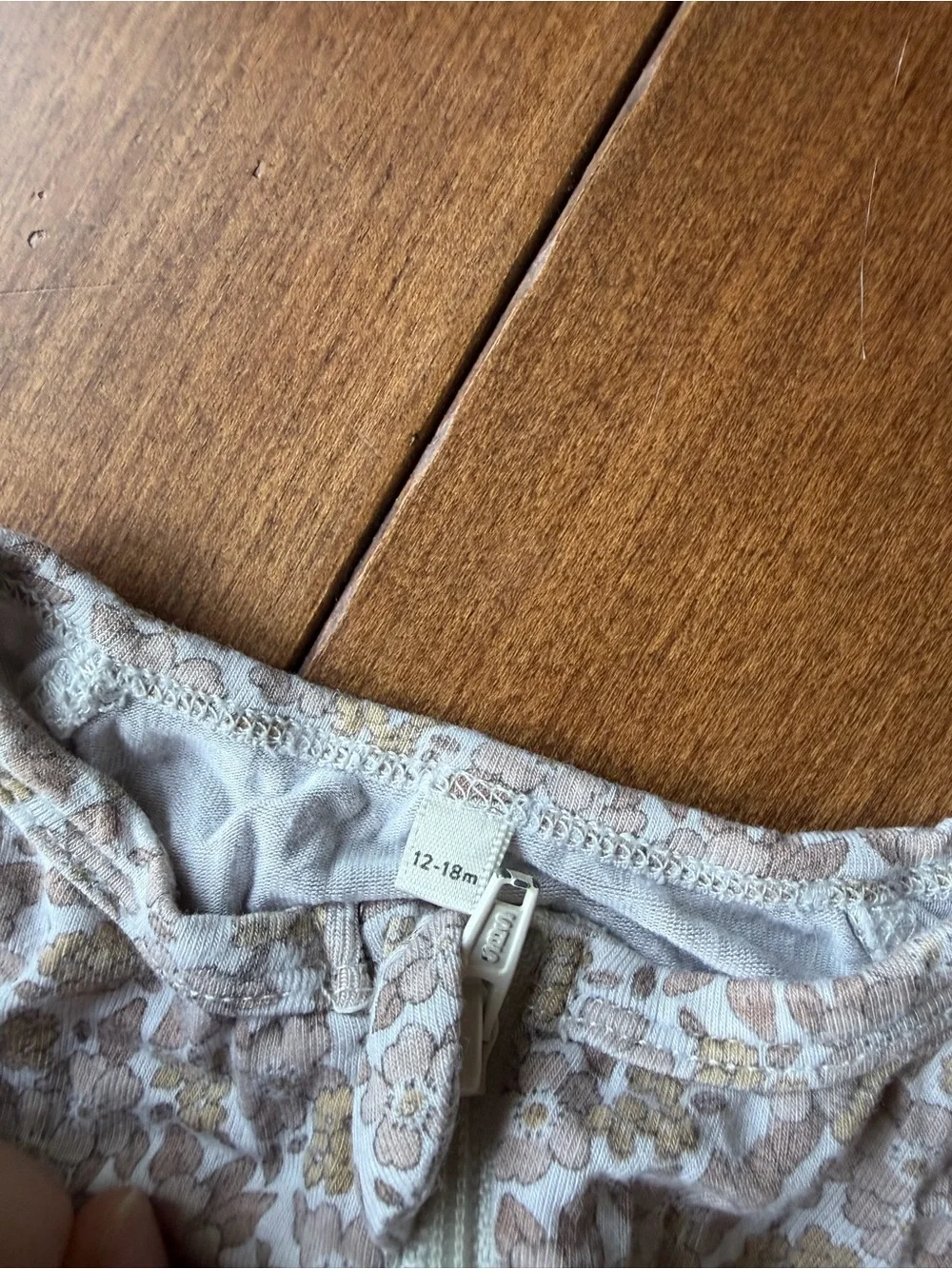 Rylee + Cru Neutral Floral Footed Zipper Romper in Beige and Cream